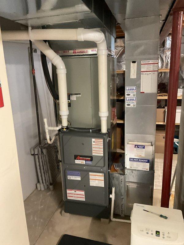 Completed comprehensive heating maintenance on residential furnace and air handler system located in basement mechanical room. Performed standard inspection of all components, verified proper operation of gas furnace unit, checked PVC condensate and vent piping connections, and inspected air handler for proper function. All equipment found to be in good working condition with clean surfaces, proper clearances maintained, and no visible signs of wear or deterioration requiring immediate attention.