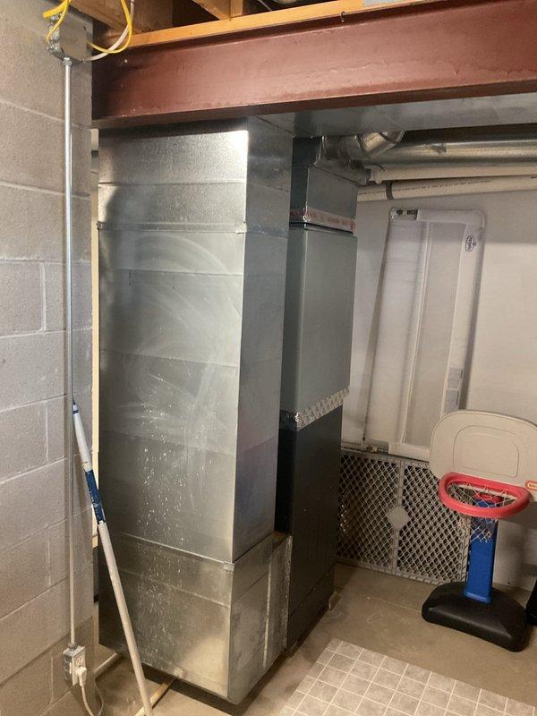Completed comprehensive heating maintenance on residential furnace and air handler system located in basement mechanical room. Performed standard inspection of all components, verified proper operation of gas furnace unit, checked PVC condensate and vent piping connections, and inspected air handler for proper function. All equipment found to be in good working condition with clean surfaces, proper clearances maintained, and no visible signs of wear or deterioration requiring immediate attention.