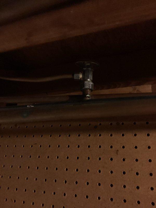 Conducted site assessment for gas line installation to service new cooking range. Inspected existing utility access points in basement/crawl space area, documenting current gas infrastructure and routing options. Evaluated kitchen layout where new gas range will be installed, noting proximity to existing electrical connections and cabinet configuration. Photographed installation area including overhead access points, structural considerations, and appliance location to prepare accurate material list and labor estimate for converting from electric to gas cooking appliance.