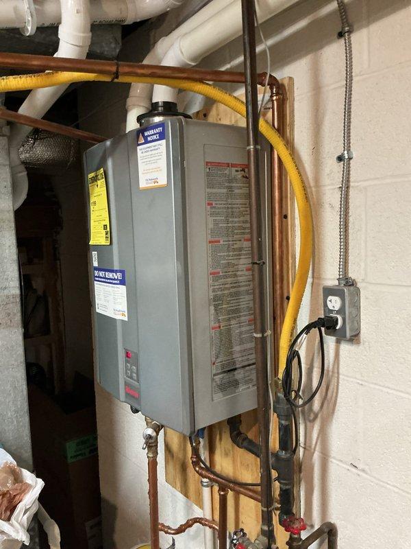 Performed routine maintenance on tankless water heater unit, including inspection of gas line connections, copper water supply lines, exhaust venting system, and electrical connections. Verified proper operation of all components, checked for any signs of corrosion or leaks, and confirmed unit specifications and warranty documentation were clearly visible and intact.