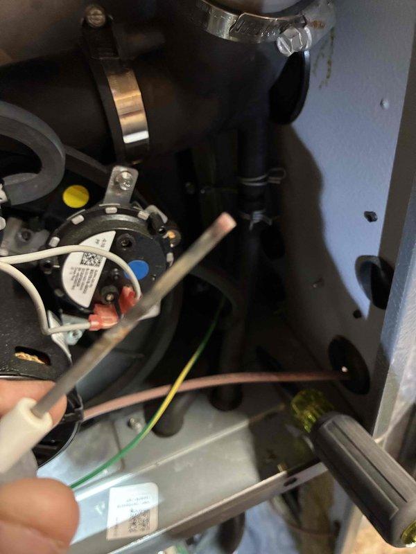 Completed comprehensive heating maintenance on residential HVAC system. Performed thorough inspection of blower motor assembly, verifying proper operation and examining electrical connections including control module wiring and terminal connections. Documented condition of blower wheel showing dust accumulation on fan blades and housing, which is normal for seasonal operation. All components functioning within normal parameters at time of service.