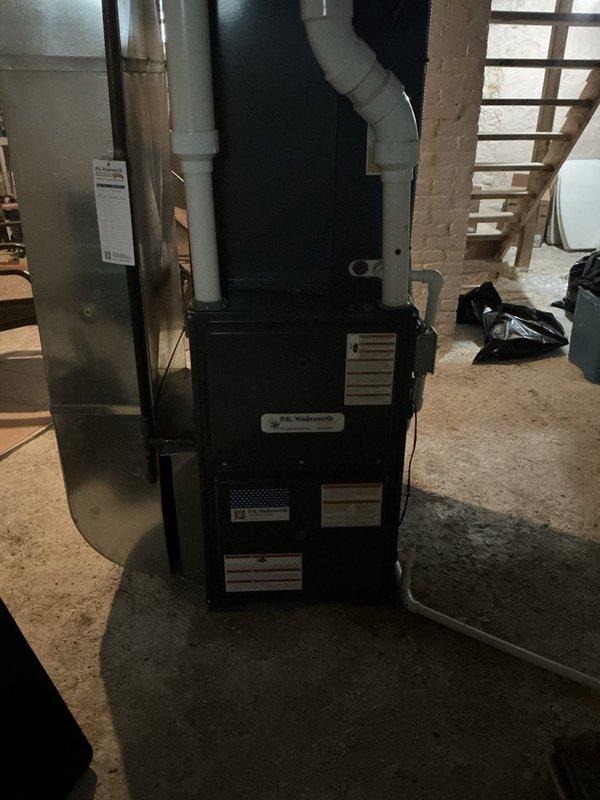 Completed comprehensive heating system maintenance inspection on residential furnace unit. Performed visual examination of Worthington brand furnace cabinet, verified proper installation and mounting in mechanical room, and inspected all accessible components including manufacturer labels and informational plates for compliance documentation. Evaluated PVC venting system connections at top of unit to ensure proper exhaust configuration and secure fittings at elbow joints.

Inspected supply ductwork connections and metallic plenum attachment to furnace cabinet for proper sealing and structural integrity. Conducted thorough examination of flexible ductwork in attic space, noting existing tape repairs on gray ribbed ducting material. Verified ductwork routing through framing members and assessed overall condition of HVAC distribution system in crawl space areas. All components found to be functioning within normal parameters with no immediate service needs identified.