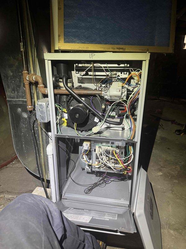 Completed comprehensive maintenance on two heating systems. Performed full system inspections with access panels removed to evaluate internal components including blower motor assemblies, electrical connections, control boards, and refrigerant lines. Documented temperature differentials using calibrated digital instrumentation, recording ambient and operational readings. Both units operating within normal parameters at 69°F upon completion of tune-up procedures.