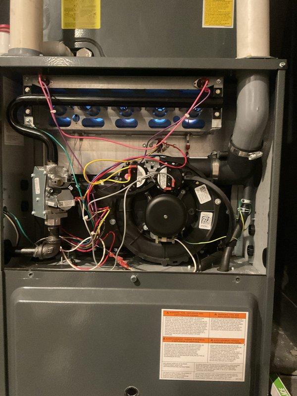 # HVAC Heating System Maintenance

Performed comprehensive heating maintenance on residential forced-air furnace system. Conducted thorough inspection of all internal components including blower motor assembly, gas valve connections, and electrical control boards. Verified proper operation of compressor unit with all electrical connections secure and properly terminated. Inspected condensate pump and drainage system for proper function. All wiring harnesses examined and found to be in good condition with appropriate color coding and routing. Control boards and safety devices tested and confirmed operational. Blower motor and capacitor inspected with no signs of wear or failure. Gas line connections and valves checked for integrity and proper seating. System cycled through complete heating operation with all components functioning within normal parameters. Unit left in full operational status with all access panels properly secured.