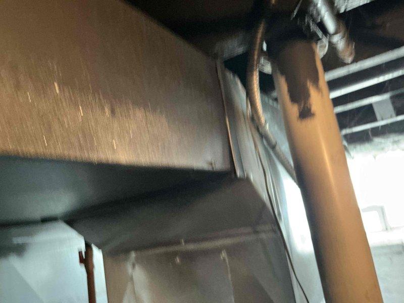 Responded to service call for complete furnace failure. Upon inspection, found existing heating system inoperable and beyond economical repair. Evaluated installation site including basement mechanical space with existing ductwork infrastructure and copper refrigerant lines. Assessed structural conditions including exposed I-beam supports and concrete block foundation walls showing moisture intrusion evidence. Provided customer with replacement furnace options and specifications based on existing HVAC configuration and space requirements. Documented current system layout and mechanical room conditions for equipment replacement planning.