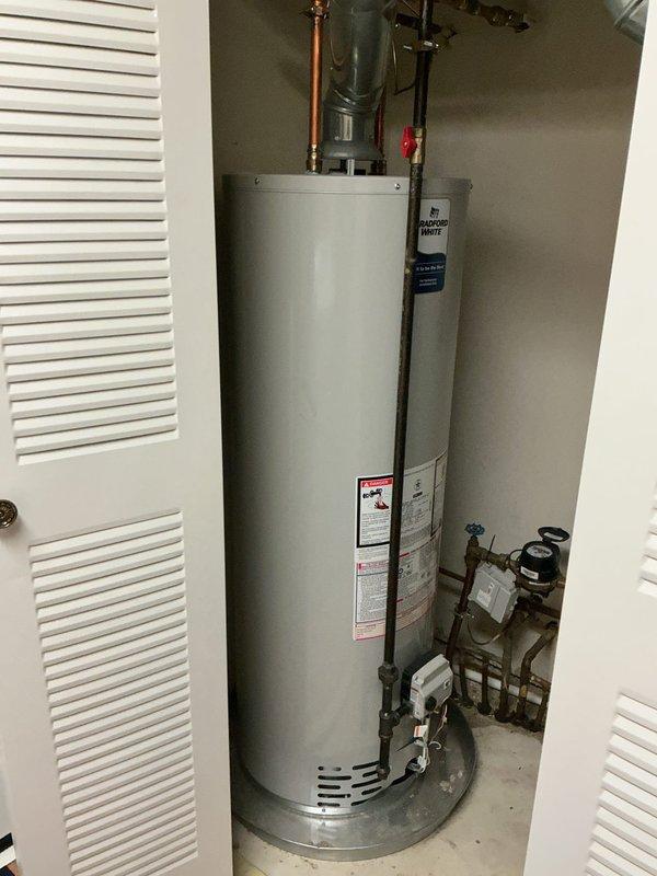 Completed first-year maintenance inspection on tankless water heater system. Performed visual assessment of all plumbing connections, copper supply lines, shut-off valves, and associated piping infrastructure. Inspected water meter assembly, valve operations, and verified proper clearances around equipment. Documented existing copper pipe oxidation and overall system condition with photographic records for maintenance history.