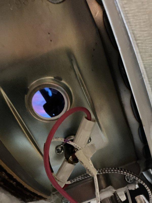 Performed annual preventative maintenance on Bradford White tanked water heater, including complete tank flush to remove sediment buildup and ensure optimal performance. Inspected all plumbing connections, pressure relief valve, and gas burner assembly, confirming proper operation with visible blue flame and adequate combustion. All components found in good working condition with no leaks detected.