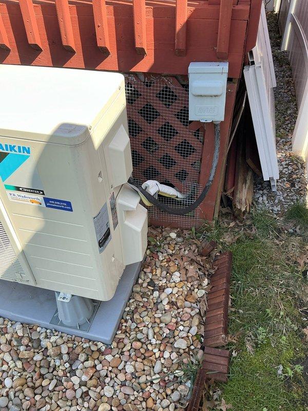 Conducted site evaluation for additional mini split system installation at residential property. Assessed existing Daikin condenser unit placement, electrical disconnect configuration, and available mounting locations. Documented current HVAC setup including outdoor unit positioning, drainage requirements, and clearance specifications to provide accurate equipment and installation quote for requested supplementary ductless system.