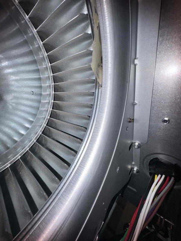 Responded to callback for persistent squealing noise that predated recent furnace replacement. Inspected blower assembly and motor components to identify source of noise captured by customer on audio/video. Examined blower wheel, housing, and electrical connections to diagnose pre-existing sound issue unrelated to new equipment installation.