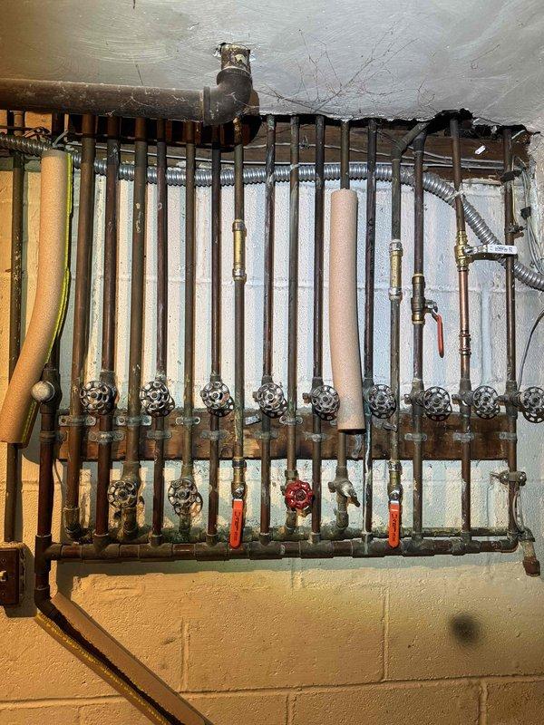 # HVAC Heating Maintenance Completed

Performed annual preventive maintenance on residential Amana furnace system as part of scheduled service plan. Conducted comprehensive inspection of heating equipment, hydronic heating distribution manifold with multiple zone control valves, ductwork connections, and associated mechanical components. All system components were inspected, tested for proper operation, and found to be functioning within normal parameters. Documentation photos captured for service records.