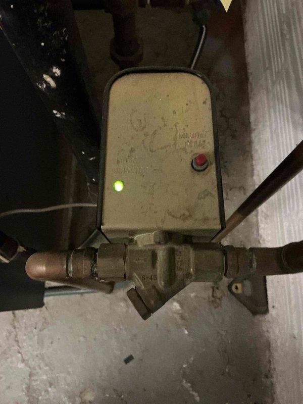 Completed scheduled preventive maintenance on water boiler heating system as part of ongoing recurring service plan. Inspected and verified proper operation of system pressure gauge reading approximately 20 PSI, pump control assembly with green indicator light showing active status, and associated valve components. All boiler components found operating within normal parameters with no immediate service needs identified.