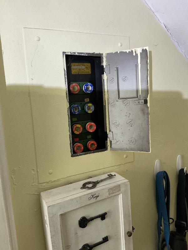 Conducted comprehensive electrical inspection of residential property. Evaluated main electrical panel installation containing eight fuses/circuit breakers with visible color-coded components and adjacent breaker switches. Documented panel condition and configuration through photographic evidence. Inspected basement electrical infrastructure including conduit runs, junction boxes, and panel connections. Assessed electrical system in relation to surrounding environmental conditions, noting moisture indicators on walls that could potentially impact electrical components. Verified proper mounting and accessibility of all electrical equipment. Completed visual inspection of all accessible electrical components and documented findings for record.