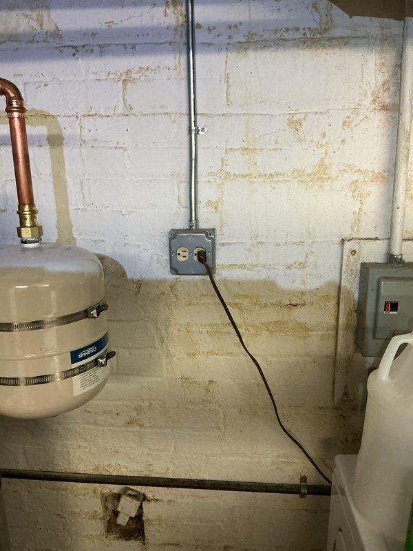 Conducted comprehensive electrical inspection of residential property. Evaluated main electrical panel installation containing eight fuses/circuit breakers with visible color-coded components and adjacent breaker switches. Documented panel condition and configuration through photographic evidence. Inspected basement electrical infrastructure including conduit runs, junction boxes, and panel connections. Assessed electrical system in relation to surrounding environmental conditions, noting moisture indicators on walls that could potentially impact electrical components. Verified proper mounting and accessibility of all electrical equipment. Completed visual inspection of all accessible electrical components and documented findings for record.