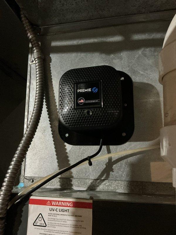 Completed comprehensive preventive maintenance service on residential HVAC system including furnace and air conditioning components. Performed full system inspection of multi-section furnace unit, air handler with filtration system, and associated ductwork. Inspected and verified proper operation of UV-C air purification system mounted in mechanical room. Checked all electrical connections, refrigerant lines, condensate drainage, and ductwork sealing. Replaced air filter, cleaned evaporator coil, and verified proper airflow throughout system. Tested all safety controls and confirmed system operating within manufacturer specifications for upcoming cooling season.