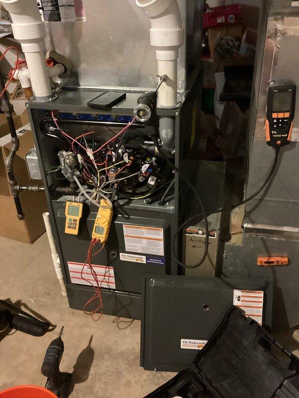 Completed annual preventative maintenance on residential furnace as part of scheduled maintenance program. Performed comprehensive system diagnostics using digital multimeter to verify proper electrical operation, measuring voltage and amperage readings to ensure components were functioning within manufacturer specifications. Conducted thorough inspection of internal components including blower assembly, heat exchanger, gas valve, ignition system, and all electrical connections. Verified proper operation of safety controls and limit switches. Inspected venting system including PVC intake and exhaust pipes for proper installation and clearances. All measurements recorded normal operating parameters, and system demonstrated proper heating cycle operation with no deficiencies noted.