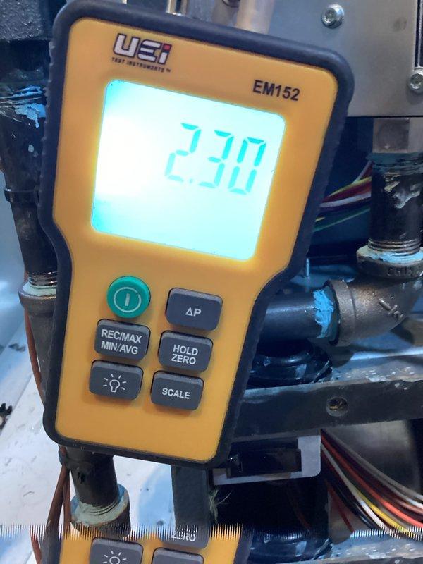 Completed comprehensive heating system maintenance and inspection. Utilized digital manometer to verify system pressures, recording 230 units on the UEi EM152 device while checking critical components and connections throughout the mechanical system. Performed detailed internal inspection using borescope camera equipment to assess interior component conditions and verify proper operation of heating elements and heat exchanger surfaces.