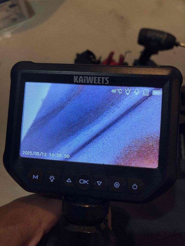 Completed comprehensive heating system maintenance and inspection. Utilized digital manometer to verify system pressures, recording 230 units on the UEi EM152 device while checking critical components and connections throughout the mechanical system. Performed detailed internal inspection using borescope camera equipment to assess interior component conditions and verify proper operation of heating elements and heat exchanger surfaces.