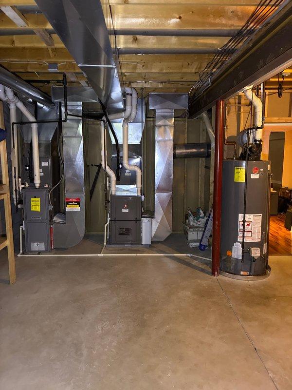 Conducted comprehensive assessment of existing basement mechanical systems including multiple furnace units and water heater for replacement estimate. Documented current HVAC equipment configuration, ductwork layout, and hot water heater installation, taking detailed measurements and photographs of all components. Provided customer with equipment replacement options for both furnace and water heater systems based on current installation parameters and mechanical room specifications.