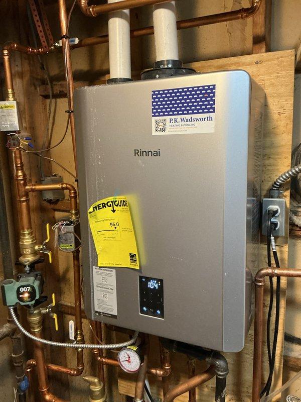 # HVAC Heating System Maintenance Completed

Performed comprehensive heating system maintenance on a Rinnai tankless water heater and associated HVAC equipment. Inspected all copper plumbing connections, pressure gauges, shut-off valves, and flexible metallic hoses for proper operation and potential leaks. Verified digital display reading of 104°F and confirmed unit functionality. Examined control boards, circuit boards with heat sinks, and all electrical wiring connections including red, yellow, black, and white conductor runs. Inspected PVC vent pipes, rubber coupling fittings, and copper refrigerant lines with brazed joints for secure installation and proper venting. All components found to be operating within normal parameters with no issues requiring immediate attention.