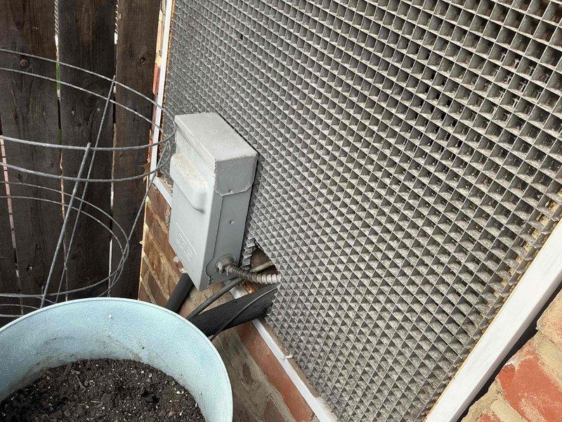 Conducted comprehensive site evaluation for full HVAC system replacement at residential property. Assessed existing outdoor unit location, electrical disconnect infrastructure, and installation area including metal grating platform and brick foundation mounting points. Documented current equipment configuration and prepared detailed replacement options for complete heating and cooling system upgrade.