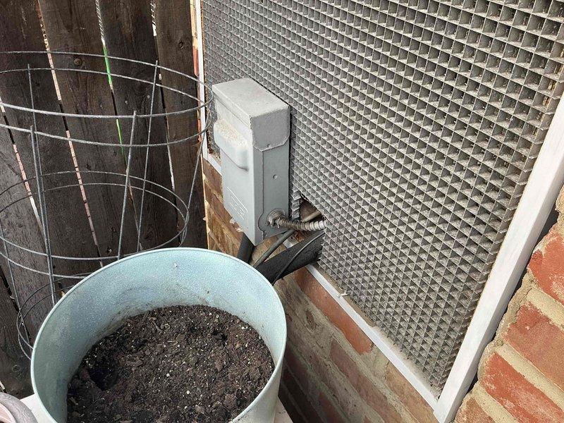 Conducted comprehensive site evaluation for full HVAC system replacement at residential property. Assessed existing outdoor unit location, electrical disconnect infrastructure, and installation area including metal grating platform and brick foundation mounting points. Documented current equipment configuration and prepared detailed replacement options for complete heating and cooling system upgrade.