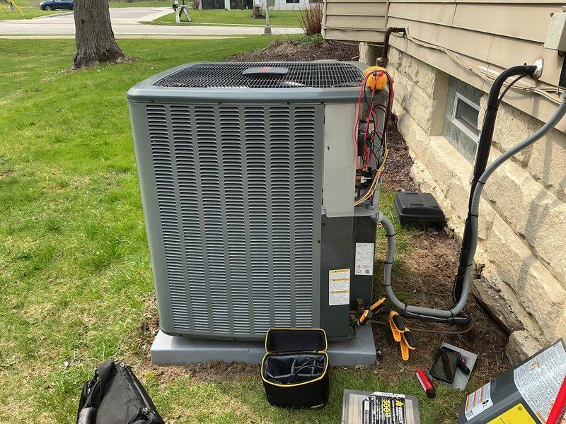 Completed cooling maintenance on residential air conditioning system. Verified thermostat reading of 72 degrees, confirmed proper airflow with fan operating in auto mode, and performed standard diagnostic testing using refrigerant gauges and meters to ensure system functionality and optimal performance.