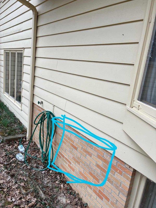 Conducted on-site evaluation for add-on mini split heat pump system installation in residential property. Assessed interior living room wall space and exterior foundation area to determine optimal placement for indoor air handler unit and outdoor condenser unit, with system intended for heating-only operation to supplement existing HVAC equipment.