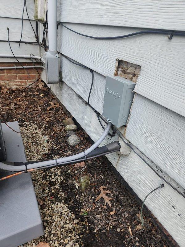 Completed installation of new air conditioning system and evaporator coil at residential property. System included ALXS3BN3010 unit with exterior condenser placement on side of building, proper electrical connections via conduit and dedicated disconnect box mounted to vinyl siding, and refrigerant line set routing along exterior wall foundation. All components tested and operational upon completion.