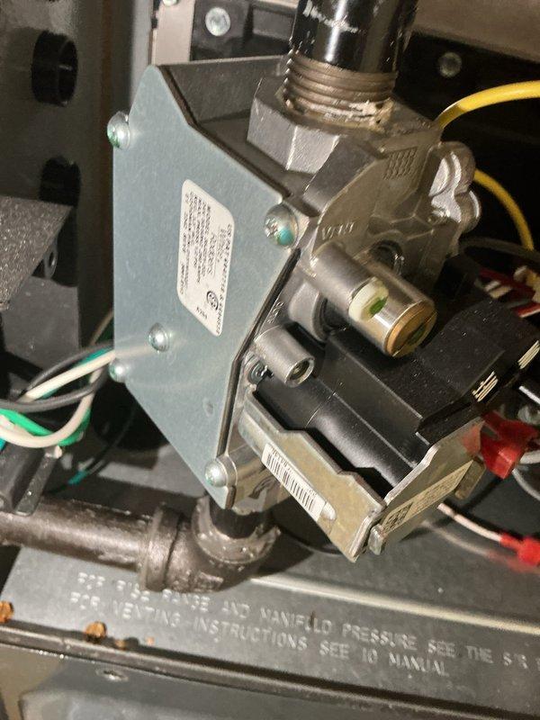 Completed comprehensive heating system maintenance inspection. Examined and verified proper operation of gas valve assembly, confirmed all electrical connections secure, and documented existing surface rust on vent pipe requiring future monitoring. All system components functioning within normal parameters at time of service.