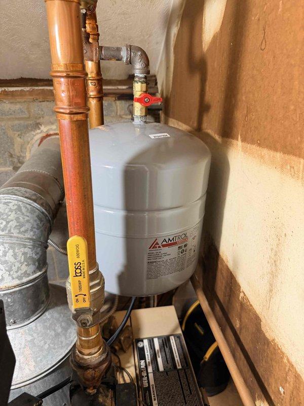 Completed routine boiler maintenance inspection including examination of the Amtrol expansion tank, associated copper piping connections, gas line valves, and related HVAC components. Verified proper operation of system controls, checked for leaks at brass fittings and compression joints, and confirmed adequate clearances around all mechanical equipment in the utility area.