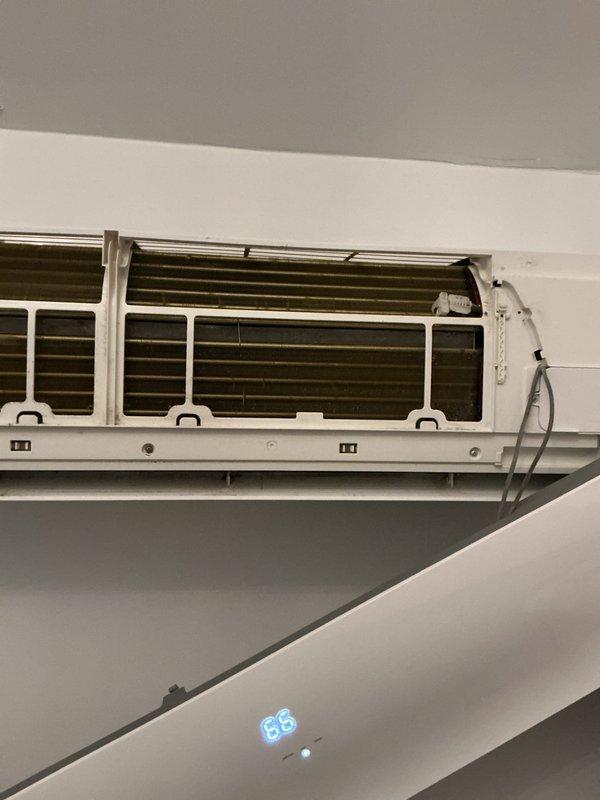 Performed preventative maintenance tune-up on wall-mounted mini split system. Opened unit housing to access evaporator coil assembly, inspected internal components including heat exchanger fins and wiring connections. Removed and cleaned two curved mesh filters that had accumulated significant dust and debris, restoring proper airflow to the system.