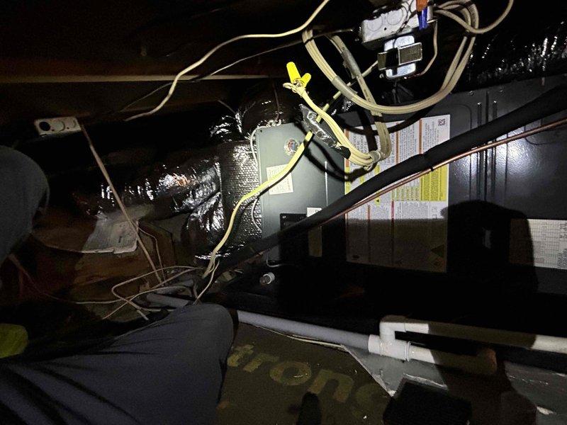 Completed installation of new black air handler unit in attic space with proper mounting and positioning. Installed and verified 250-amp rated FLNR fuses in disconnect assembly, connected flexible ductwork, and completed all electrical wiring connections including proper wire management and terminations. System inspected and confirmed operational with all manufacturer specifications met and balance collected upon completion.