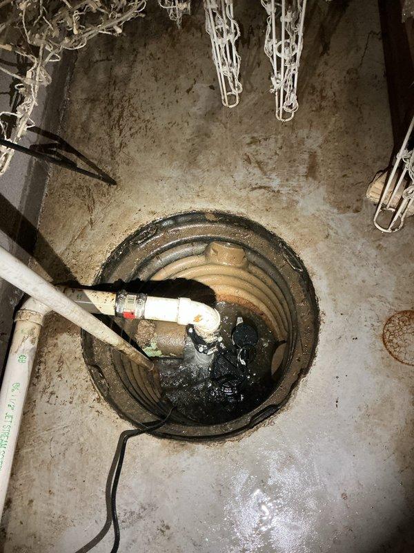 Responded to emergency call for failed sump pump with electrical burning odor and complete drainage failure. Upon inspection, found existing pump had catastrophically failed with visible damage to electrical components and motor assembly. Removed defective unit from pit, which showed signs of thermal damage and mechanical seizure. Installed new residential-grade sump pump, reconnected discharge piping to existing PVC system, and verified proper float switch operation. Tested unit through multiple cycles to ensure adequate water removal and confirmed all electrical connections were secure with no abnormal odors or sounds during operation.
