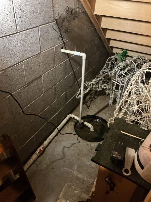 Responded to emergency call for failed sump pump with electrical burning odor and complete drainage failure. Upon inspection, found existing pump had catastrophically failed with visible damage to electrical components and motor assembly. Removed defective unit from pit, which showed signs of thermal damage and mechanical seizure. Installed new residential-grade sump pump, reconnected discharge piping to existing PVC system, and verified proper float switch operation. Tested unit through multiple cycles to ensure adequate water removal and confirmed all electrical connections were secure with no abnormal odors or sounds during operation.