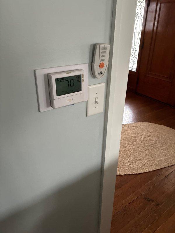 Conducted on-site evaluation of existing residential HVAC system per customer request for cooling system replacement estimate. Assessed current furnace and air conditioning equipment, documenting existing thermostat configuration and furnace installation with exposed internal components including blower motor assembly, gas valve connections, and control wiring. Provided comprehensive replacement options for complete system upgrade to address reported cooling system failure.