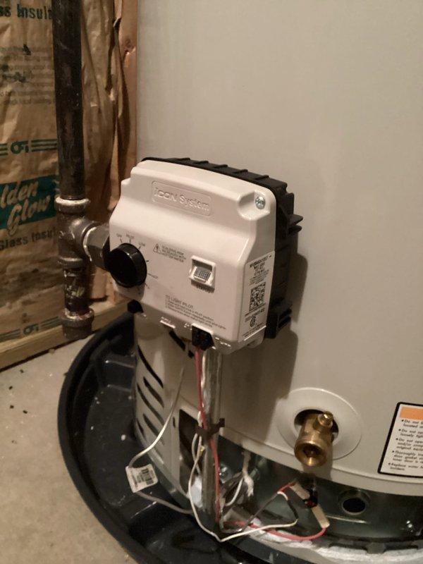 Responded to no hot water complaint at residential property. Upon arrival, inspected tanked water heater installation in basement utility area. Evaluated gas control valve assembly, thermocouple connections, and pilot light operation. Checked electrical connections to control box and verified proper wiring to white and red leads. Inspected copper supply lines, brass fittings, and shut-off valves for proper operation. Assessed venting system including metallic ductwork connections at top of unit. Verified all safety labels and warning stickers were intact and legible. Diagnosed issue and restored hot water service to residence.