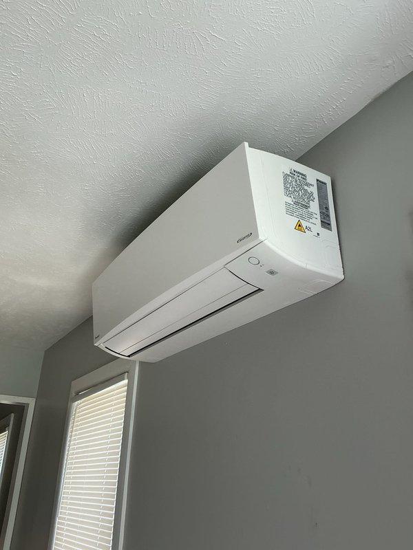 Completed first-year heating maintenance on a Daikin ductless heat pump system. Performed diagnostic testing on the outdoor condensing unit using digital multimeter to verify electrical connections and component operation, inspected indoor wall-mounted air handler for proper function, and confirmed system operational status with no issues found.