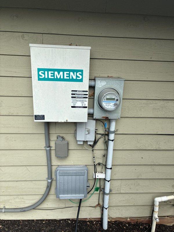Conducted full system replacement estimate for aging HVAC system originally installed in 2009. Documented existing electrical service equipment including Siemens outdoor panel, digital electric meter, and associated conduit routing, as well as current thermostat configuration with programmable digital controls and HVAC wiring connections. Provided comprehensive replacement options for complete system upgrade.