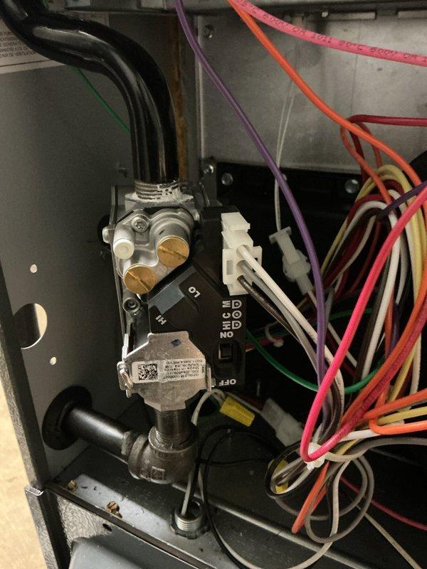 Returned to property to replace defective gas valve on residential furnace. Removed old gas valve assembly, installed new unit, reconnected gas piping and electrical connections, and verified proper ignition sequence and burner operation with all flames burning blue and stable.