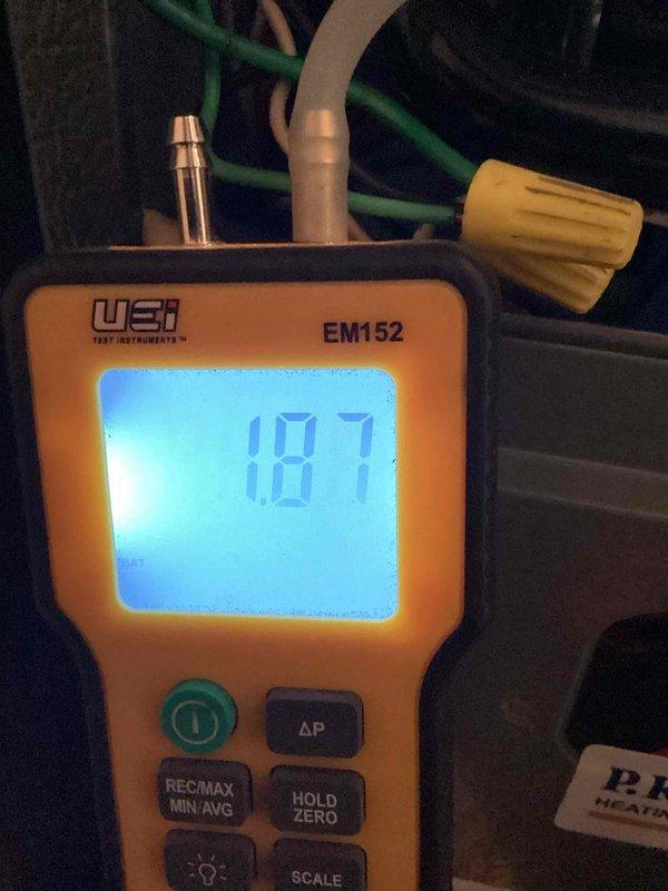 Completed first-year heating system maintenance inspection and performance verification. Conducted comprehensive combustion analysis using Testo 310 analyzer and measured static pressure differentials with UEI EM152 digital manometer to ensure system operating within manufacturer specifications. All readings documented and system found to be functioning properly with no deficiencies noted.