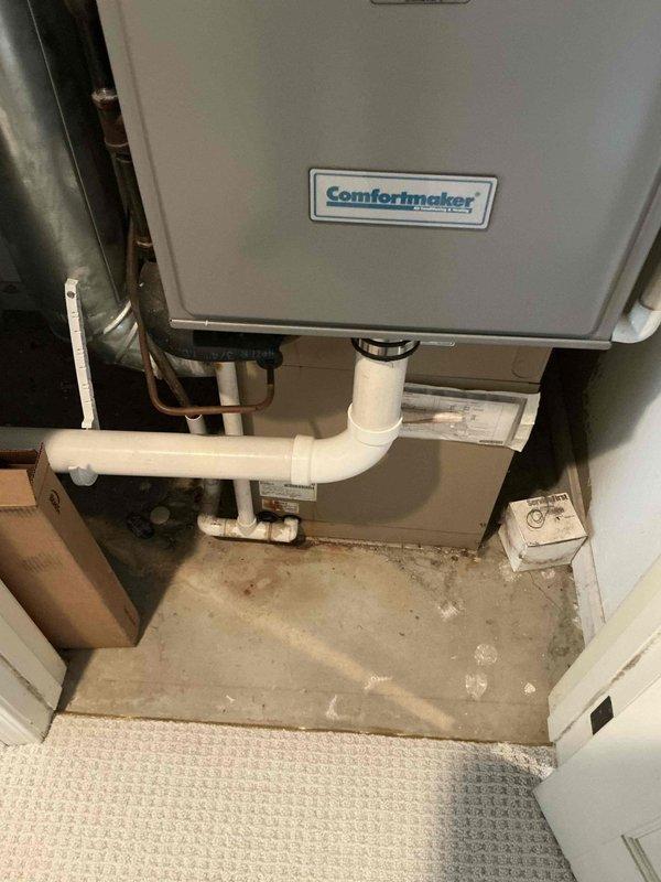 Completed HVAC system evaluation for equipment replacement options. Documented existing Comfortmaker air handler/furnace unit in interior mechanical closet with PVC condensate drainage system and copper refrigerant lines. Assessed outdoor Lennox condensing unit model HS29-030-1P utilizing R-22 refrigerant. Photographed equipment specifications, installation configuration, and current system condition to provide comprehensive replacement recommendations.