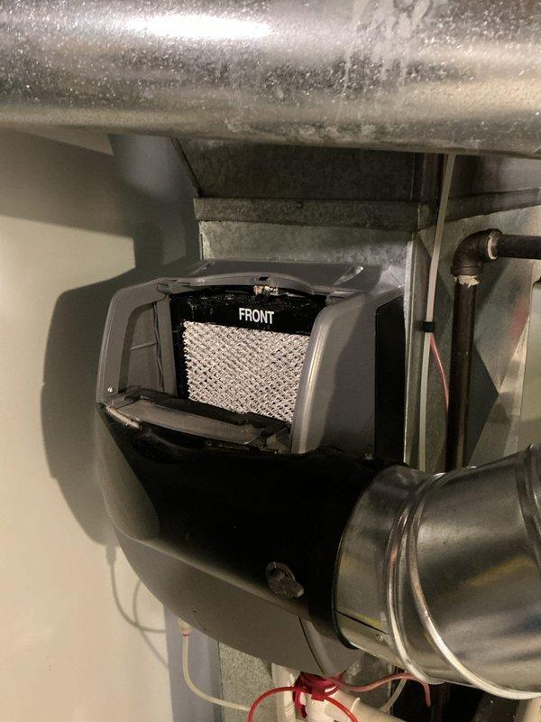 Completed scheduled heating maintenance on a Goodman brand furnace system. Performed comprehensive inspection of the unit, including examination of the heat exchanger, burner assembly, and ventilation components. Inspected and verified proper operation of the air intake filter assembly marked on the front panel, noting the white mesh filter screen was accessible and in serviceable condition. Checked all electrical connections, including visible wiring and safety controls. Examined PVC condensate drain lines and venting system for proper installation and drainage. Inspected flexible ductwork connections at the top of the unit and metal ductwork components for secure mounting and proper airflow. Verified all manufacturer labels, safety stickers, and compliance plates were intact and legible. System operational and functioning within normal parameters upon completion of maintenance procedures.