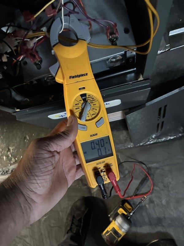 Completed comprehensive heating maintenance on residential HVAC system. Performed diagnostic measurements using clamp meter to verify proper electrical readings and system performance, inspected blower motor assembly and fan operation, and examined air filter condition within the air handler unit. All components found to be operating within normal parameters with no immediate service needs identified.