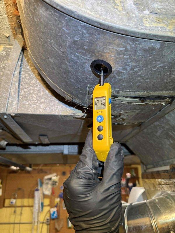 Completed annual heating maintenance visit on furnace system as part of recurring maintenance program. Performed comprehensive inspection of heating equipment, verified proper operation of UV-C light air purification system mounted on supply ductwork, and measured temperature differential across heat exchanger registering 12.76 degrees. All components found operating within normal parameters with no deficiencies noted.