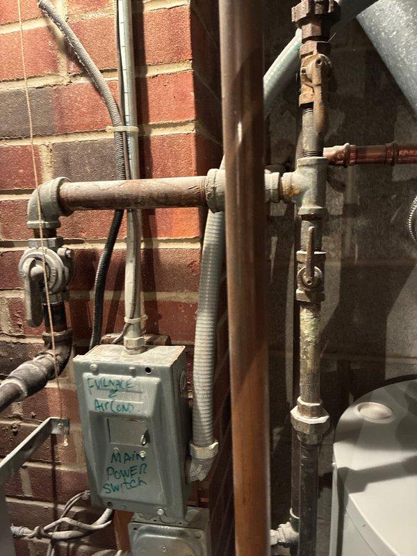 Conducted comprehensive site assessment for full HVAC system replacement at residential property with rooftop unit configuration. Evaluated existing mechanical equipment in basement utility area, including water heater, furnace connections, and associated plumbing infrastructure. Documented current system layout featuring exposed brick wall-mounted components, copper piping configurations, gas lines, and electrical panels. Assessed rooftop unit accessibility via walk-out access point, confirming straightforward installation conditions. Provided customer with multiple full system replacement options based on existing equipment age, current configuration, and ease of access for equipment changeout.