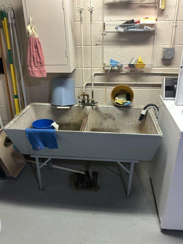 Performed routine maintenance flush on residential tanked water heater to remove sediment buildup and ensure optimal performance. Drained unit completely through bottom drain valve into utility sink, cleared accumulated mineral deposits, refilled system, and verified proper operation of all components including temperature/pressure relief valve and heating elements.