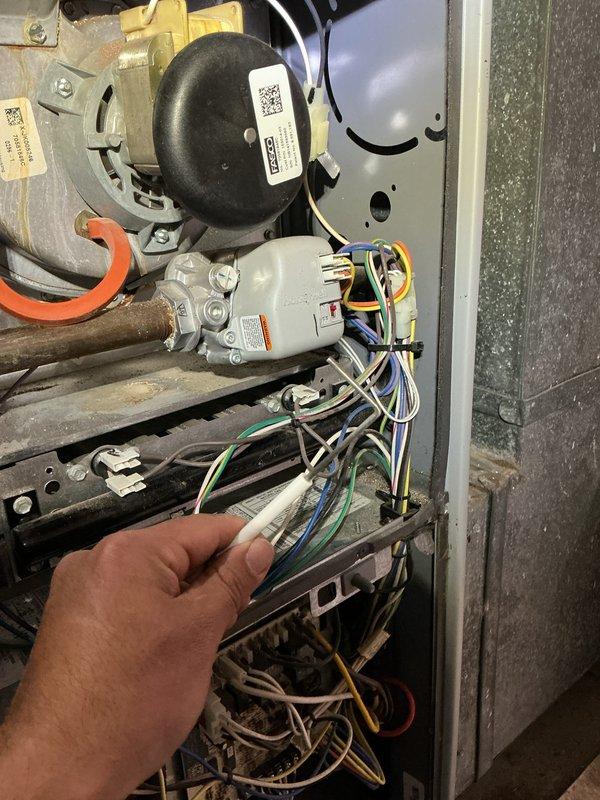 Completed routine heating maintenance inspection on HVAC system. Accessed interior components through main service panel, inspected electrical connections and wiring harnesses for proper termination and signs of wear, verified compressor unit condition, and examined refrigerant line insulation and valve assemblies. Cleaned accumulated dust and debris from interior compartment and surrounding surfaces to ensure optimal airflow and system efficiency.