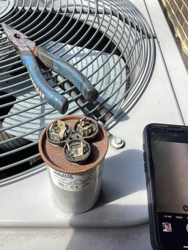 Performed comprehensive cooling system maintenance evaluation on outdoor condenser unit following initial sales consultation. Inspected and tested capacitor, which showed signs of age and was removed for testing, confirmed electrical connections and terminals were functioning properly. Completed full system assessment to provide technical recommendations for potential complete HVAC system replacement.