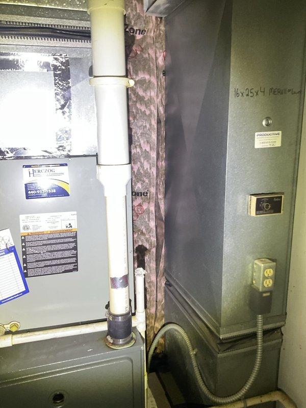 Completed comprehensive heating maintenance on two HVAC systems located in basement utility area. Performed standard seasonal inspections on gray furnace unit and secondary air handler, including filter verification (16x25x4 MERV11-13), visual inspection of electrical components and control panels, examination of PVC venting systems, and assessment of refrigerant line connections. Both systems checked for proper operation with all safety labels and documentation confirmed in place.