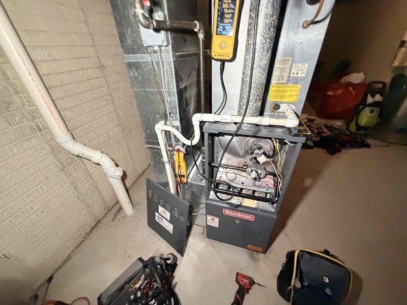 Completed comprehensive heating maintenance on Goodman furnace system. Performed thorough inspection of blower motor assembly, verified electrical connections, tested control board functionality, and examined all internal mechanical components with access panels removed. Inspected PVC condensate drainage system, ductwork insulation integrity, and confirmed proper system operation using diagnostic testing equipment.